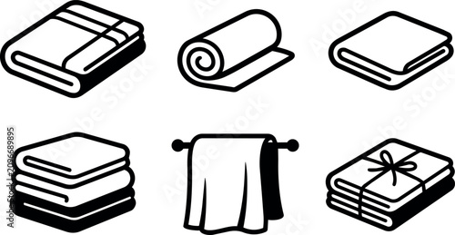 Black and white line art folded towels and rolled blanket icons set