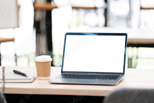 Laptop Mockup on Wooden Table in Cafe