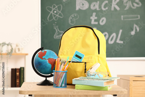 Yellow backpack with school...