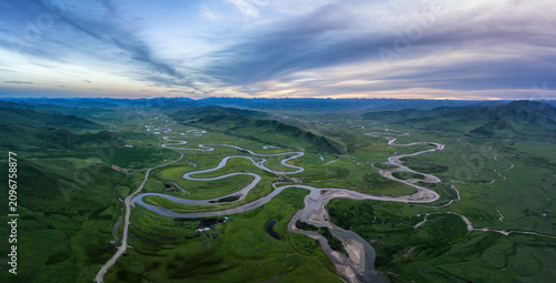 Foto Sunset Panorama of Manzatang Wetland: Sunset Glow, Meandering Rivers and Endless