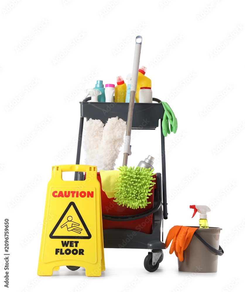Naklejka premium Professional cleaning service cart with various supplies and a yellow wet floor sign, isolated on a white background, a professional cleaning service cart is equipped with various cleaning supplies