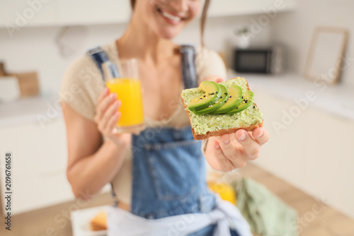 Smiling woman holding avoca...