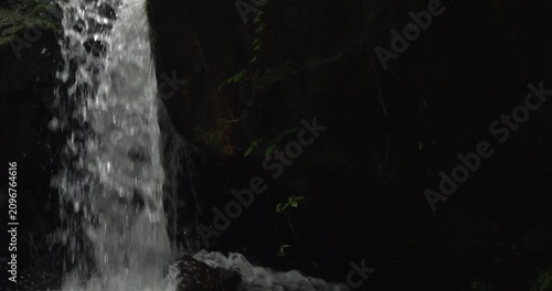 Cascading Waterfall Over Rocky Cliffside in Nature