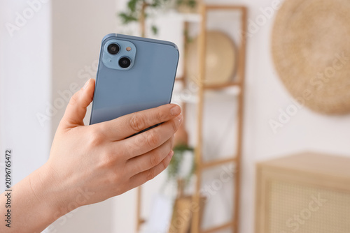 Person holding a blue smart...