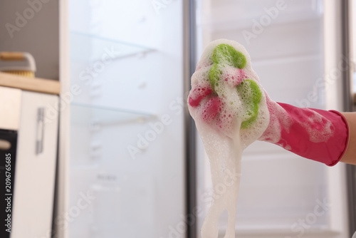 Hand in pink rubber glove h...