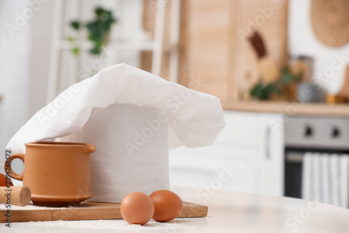 Chefs hat, eggs and utensil...