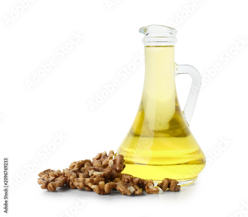 Tasty walnuts and jug of oi...