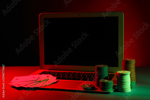 Laptop with playing cards a...