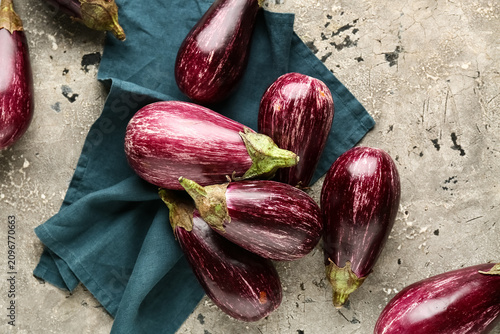 Fresh ripe eggplants on gre...