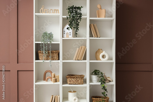 Bookshelf with wicker baske...