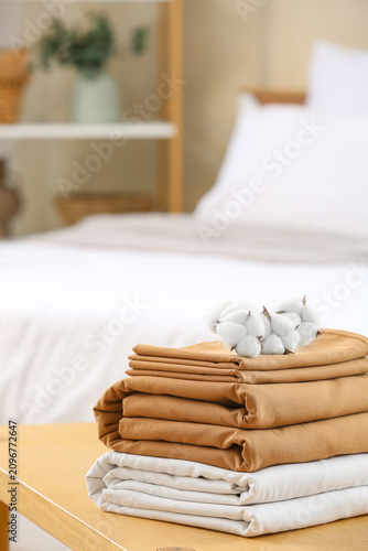 Stack of clean bed linen wi...