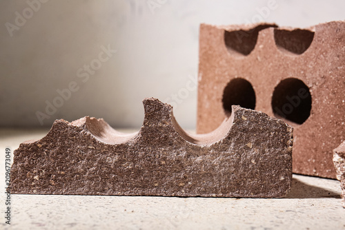 Broken brick on light grung...