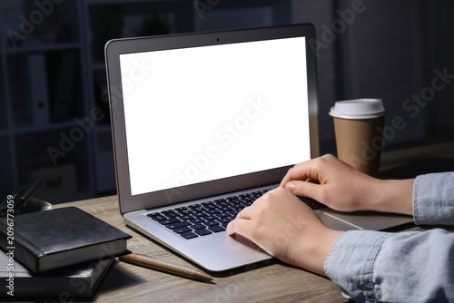 Woman with modern laptop, c...