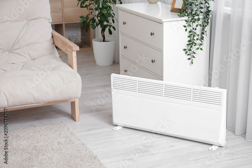 Electric heater on floor ne...