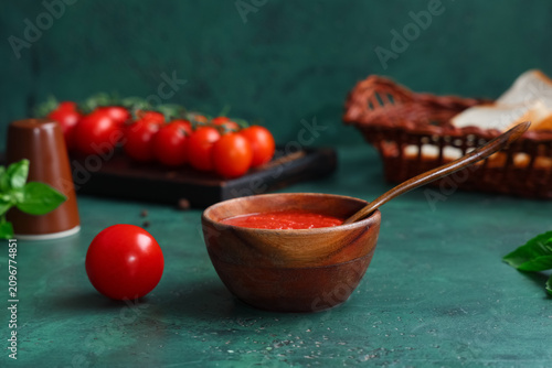 Wooden bowl of tomato sauce...