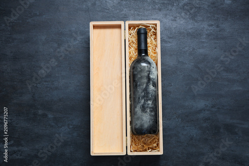 Box with bottle of wine on ...