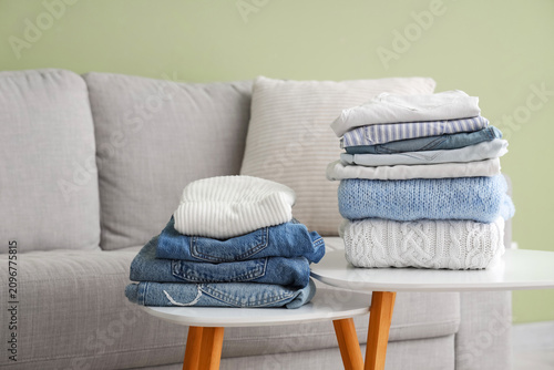 Stacks of clean clothes on ...