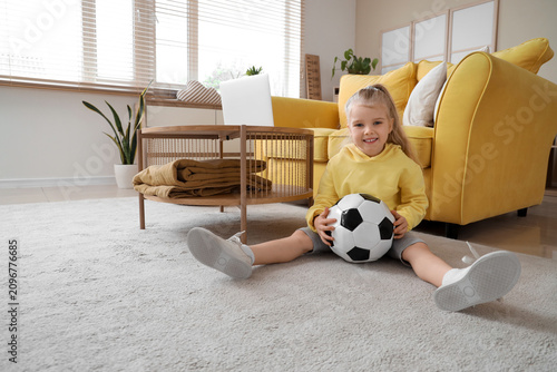 Cute little girl with socce...