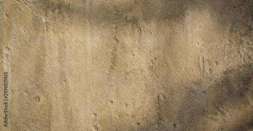 Foto Close-up of a textured brown wall with a rough, uneven surface, showcasing natural imperfections and subtle shadows, ideal for backgrounds or design