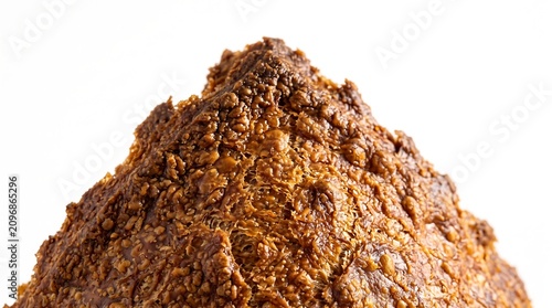 Macro view of crusty artisanal bread peak isolated on white background