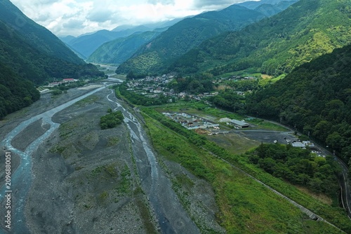 Aerial drone photo of mountain valley river and village in Abe River area, Shizuoka, Japan