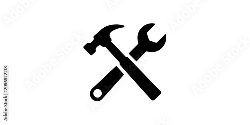 Black silhouette icon of a crossed hammer and wrench representing construction repair and maintenance tools
