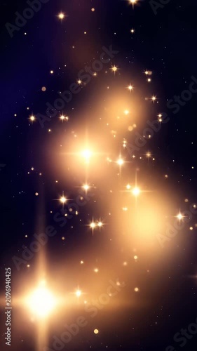 Sparkling gold stars and bokeh on dark blue background