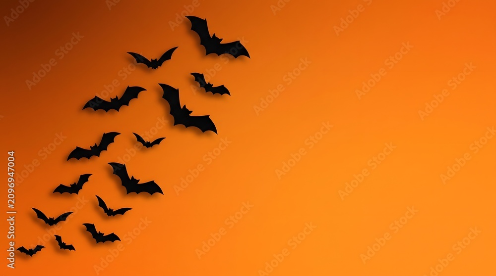 Fototapeta premium Spooky halloween bats flying on orange background perfect for october 31st party decorations seasonal designs