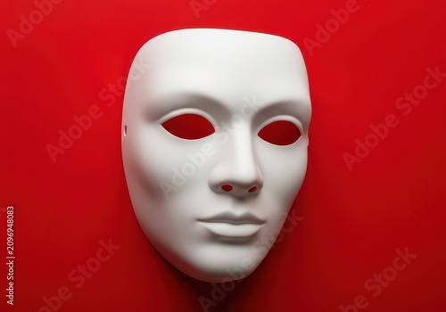 Blank white theatrical face mask on red background