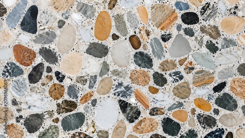 Terrazzo flooring texture with multi-colored stone chips and polished concrete surface