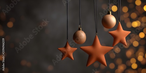 Hanging orange star and ball Christmas ornaments on black strings