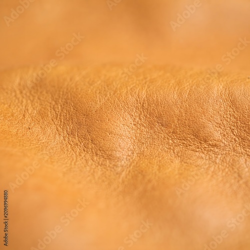 Close-up of golden glitter texture background. Shimmering metallic sparkle surface for luxury design and festive decoration.