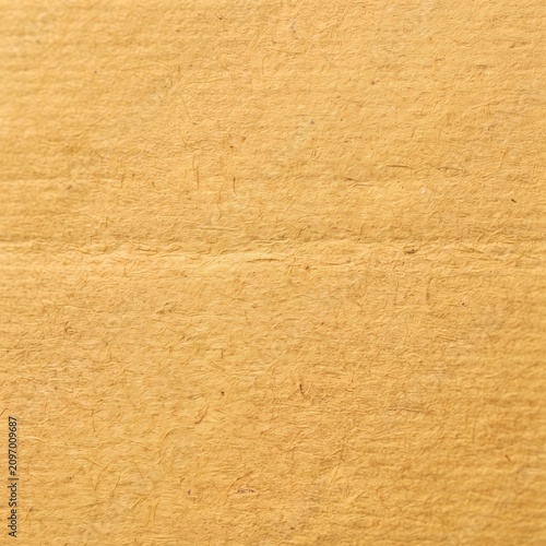 Close-up texture of natural beige linen fabric. Smooth woven material background for design and fashion projects.