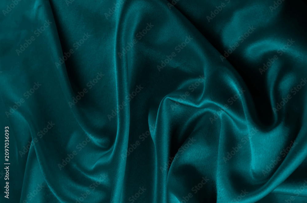 Fototapeta premium Deep teal fabric texture with soft folds