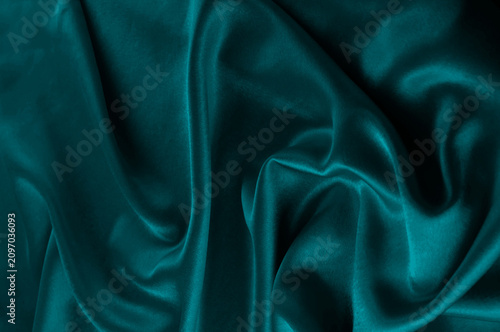 Deep teal fabric texture with soft folds
