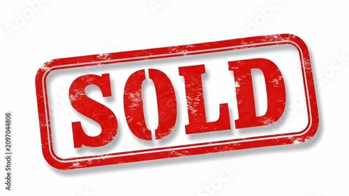 A red grunge rubber stamp with the word sold isolated on a white background