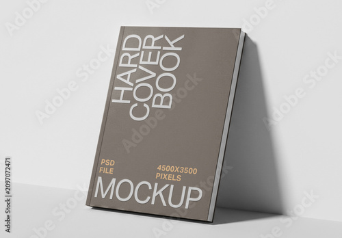 Hardcover Book Mockup Leaning Against Wall in Perspective View for Cover Presentation