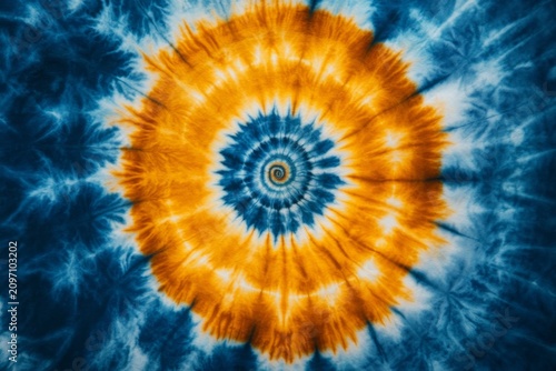 selective focus artisans creating vibrant tie-dye swirling patterns during textile workshop