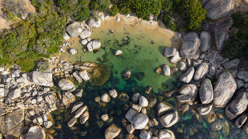 Photography Top down aerial view of smooth coastal rocks between Camps Bay and Hout Bay, South Africa