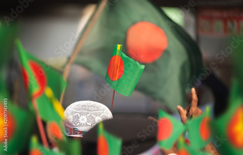 Dhaka, bangladesh- 16 Dec 2025: Bangladesh national flag held during a public celebratory event.