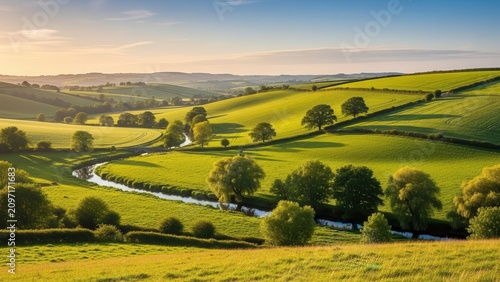 Rolling Green Hills and River in Golden Hour Sunlight