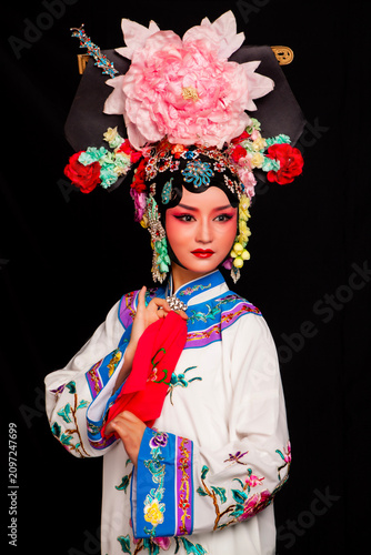 фотографія Ancient Asian opera costumes against a black background
