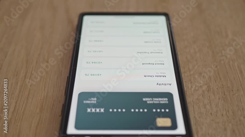 Checking account balance and direct deposits on smartphone display, financial tracking concept.