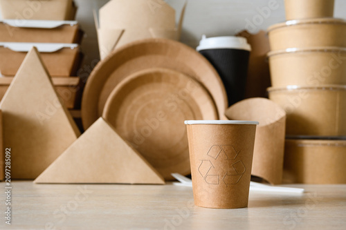 Paper cup with a recycling symbol. Made from recycled paper. Zero waste.