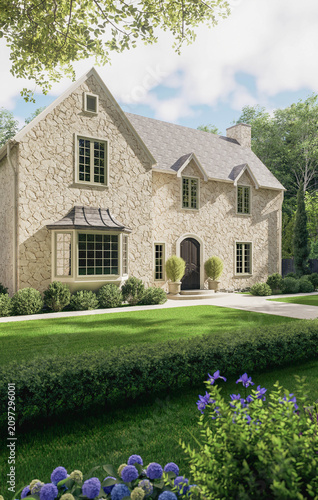 Beautiful traditional stone cottage with a blooming summer garden
