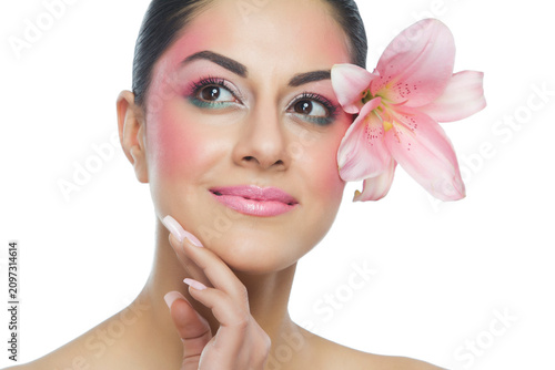 Portrait of a beautiful woman with flower