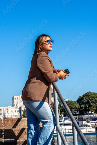 Photography Young woman enjoying leisure time at barcelona port