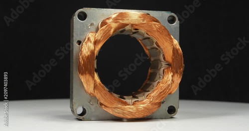 Large stator of electric motor with copper coil from household appliances
