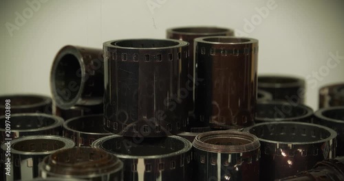 Old camera film for retro photo shoots. Vintage film rolls for classic photography. Old photographic films. Developed retro film rolls from analog cameras