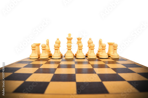 Chess pieces arranged on a wooden board.